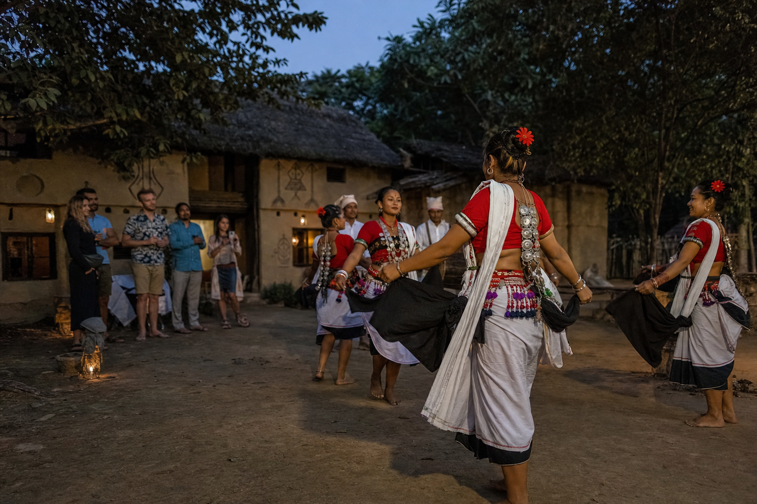 Tharu dancers performing in a village courtyard as guests watch respectfully